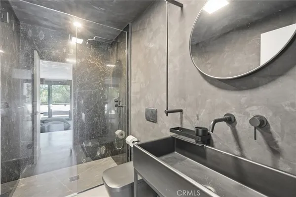 a view of a patio with table and chairs and wooden floor