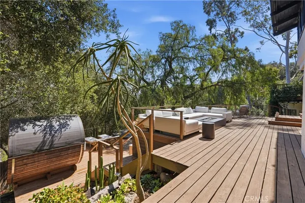 a view of a backyard with sitting area