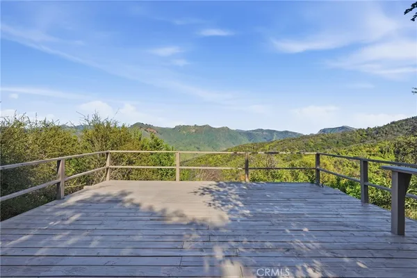 a view of a back yard from a balcony