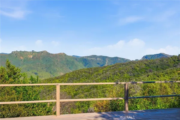 an aerial view of a house with yard and outdoor space