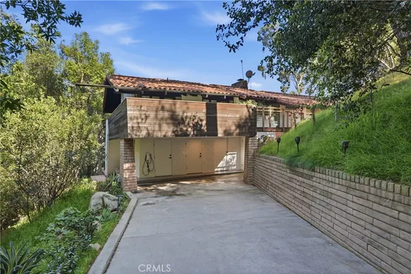a view of a house with a tree park