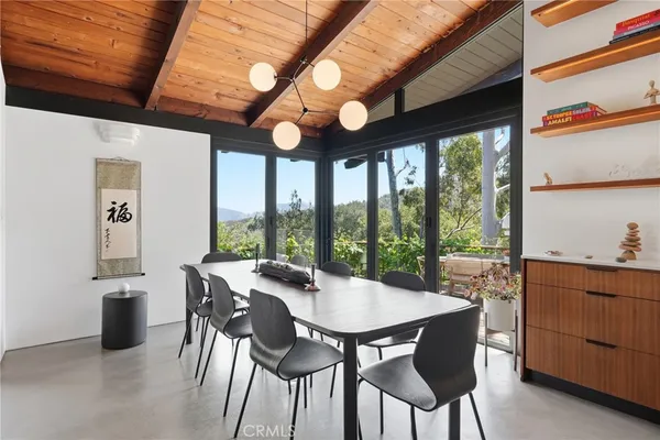 a view of a dining room with furniture window and outside view