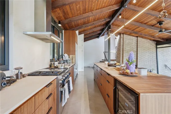 a kitchen with stainless steel appliances granite countertop a sink and stove