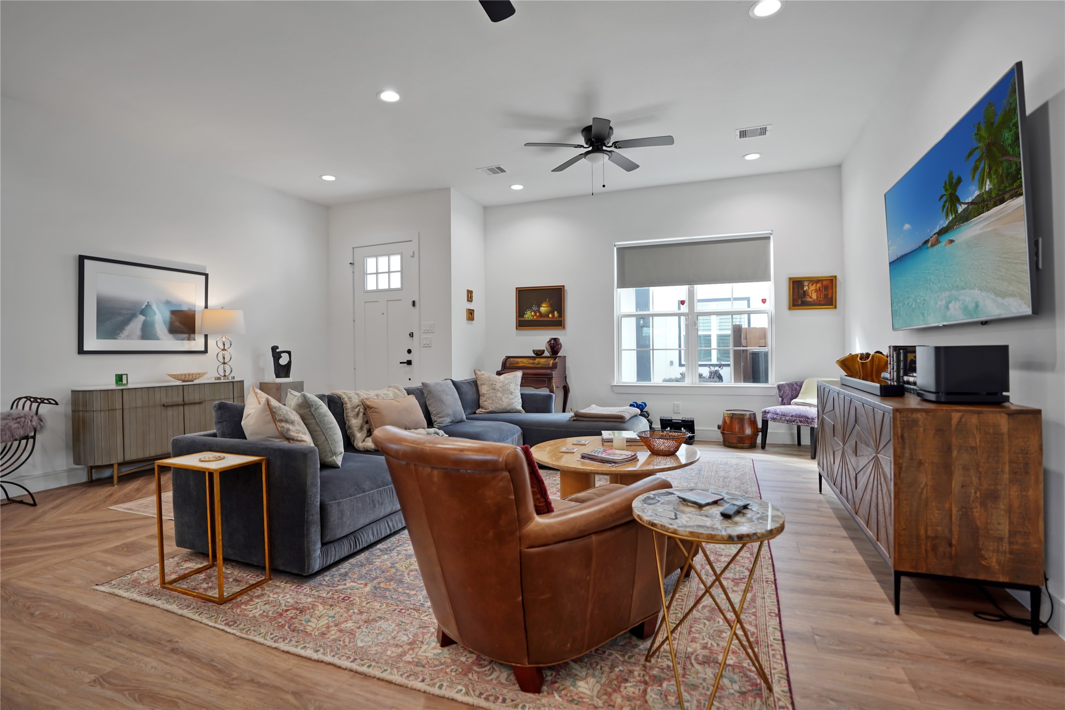 303 Blueberry Street, Unit B Houston, TX 77018 - Photo 11 of 39 a living room with fireplace furniture and a flat screen tv