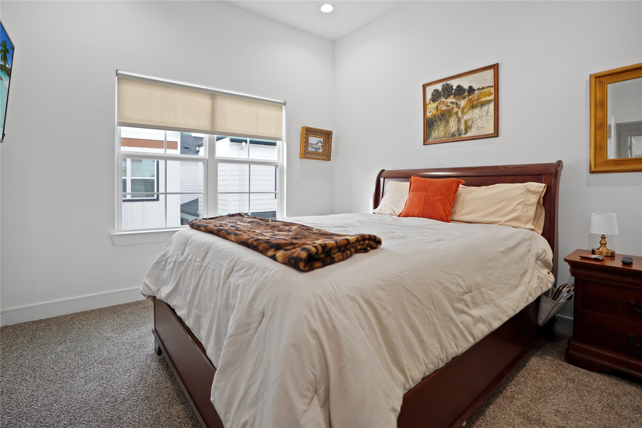 303 Blueberry Street, Unit B Houston, TX 77018 - Photo 29 of 39 a bedroom with a bed and a window