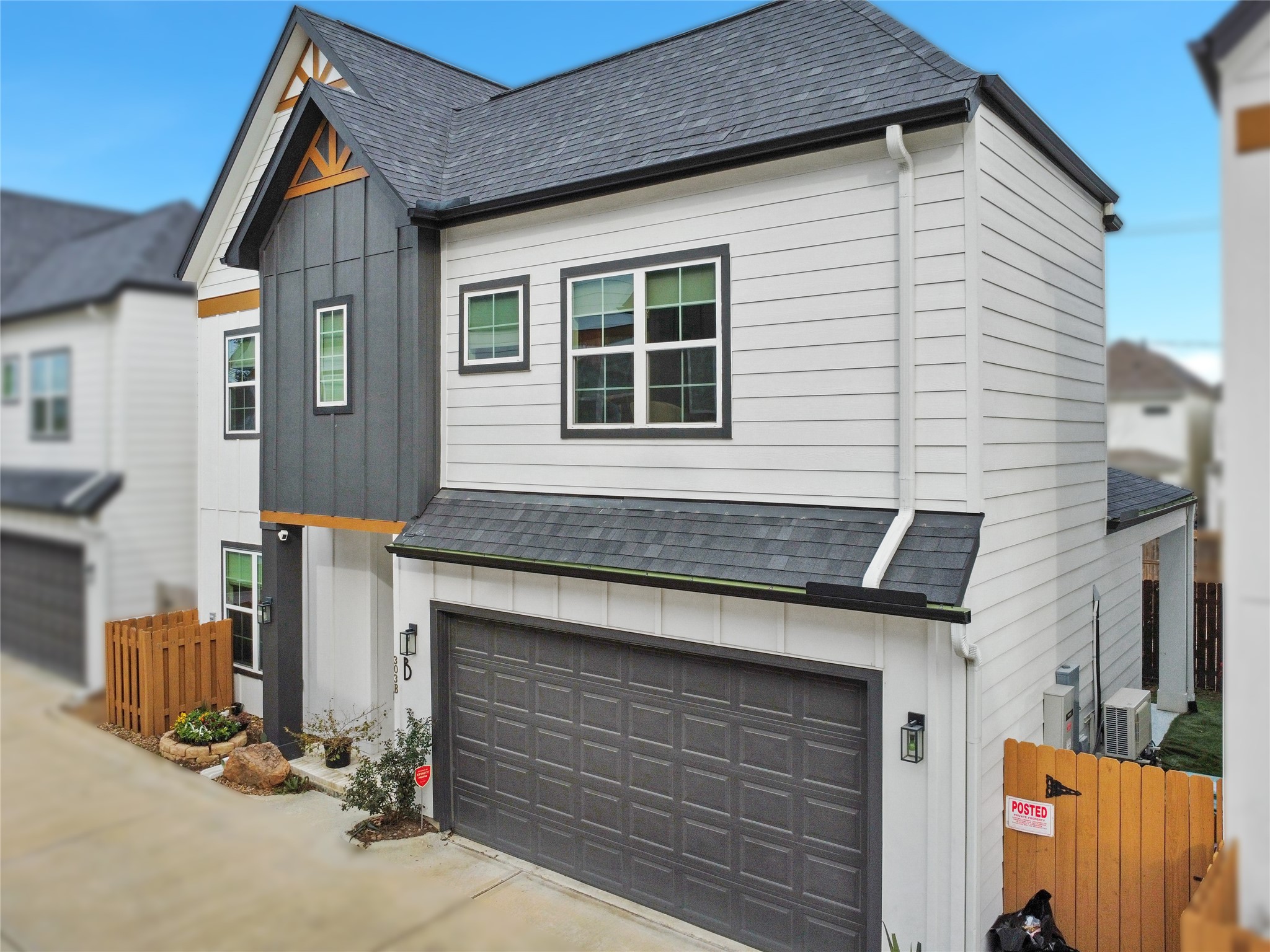 303 Blueberry Street, Unit B Houston, TX 77018 - Photo 3 of 39 a front view of a house with a garage