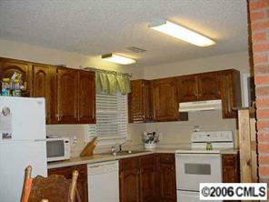 914 Circle S Ranch Road Monroe, NC 28112 - Photo 3 of 8 a kitchen with a sink a stove and refrigerator