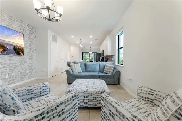 a bedroom with a bed a couch and dresser