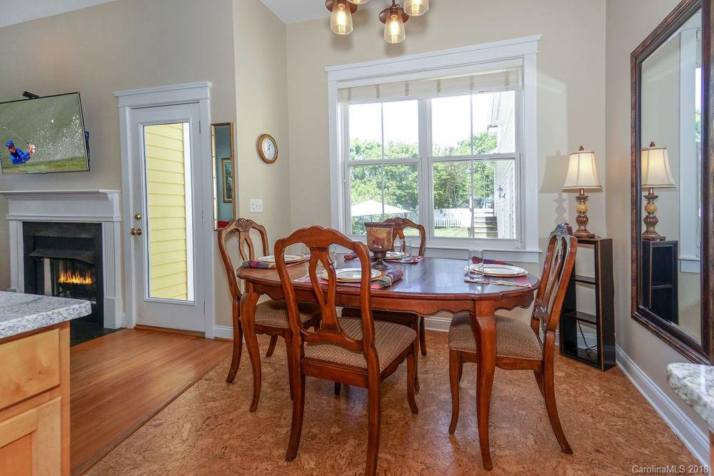 8117 Strandhill Road Huntersville, NC 28078 - Photo 11 of 36 a view of a dining room with furniture and wooden floor