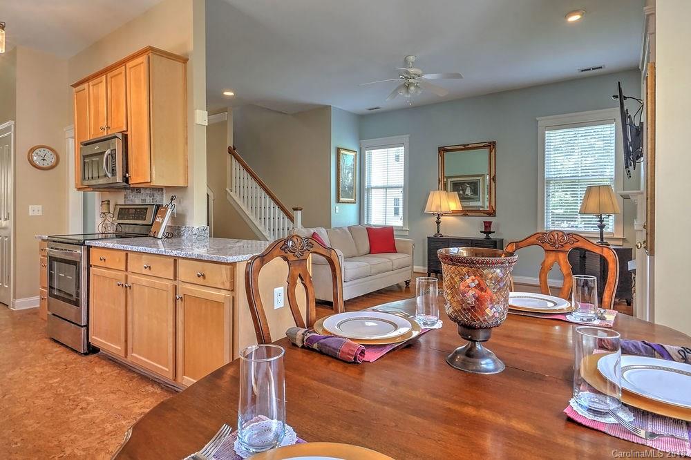 8117 Strandhill Road Huntersville, NC 28078 - Photo 12 of 36 a living room with furniture windows and a table