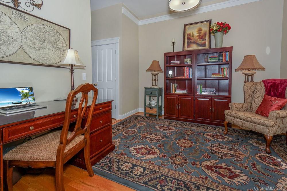 8117 Strandhill Road Huntersville, NC 28078 - Photo 15 of 36 a living room with furniture and book shelf