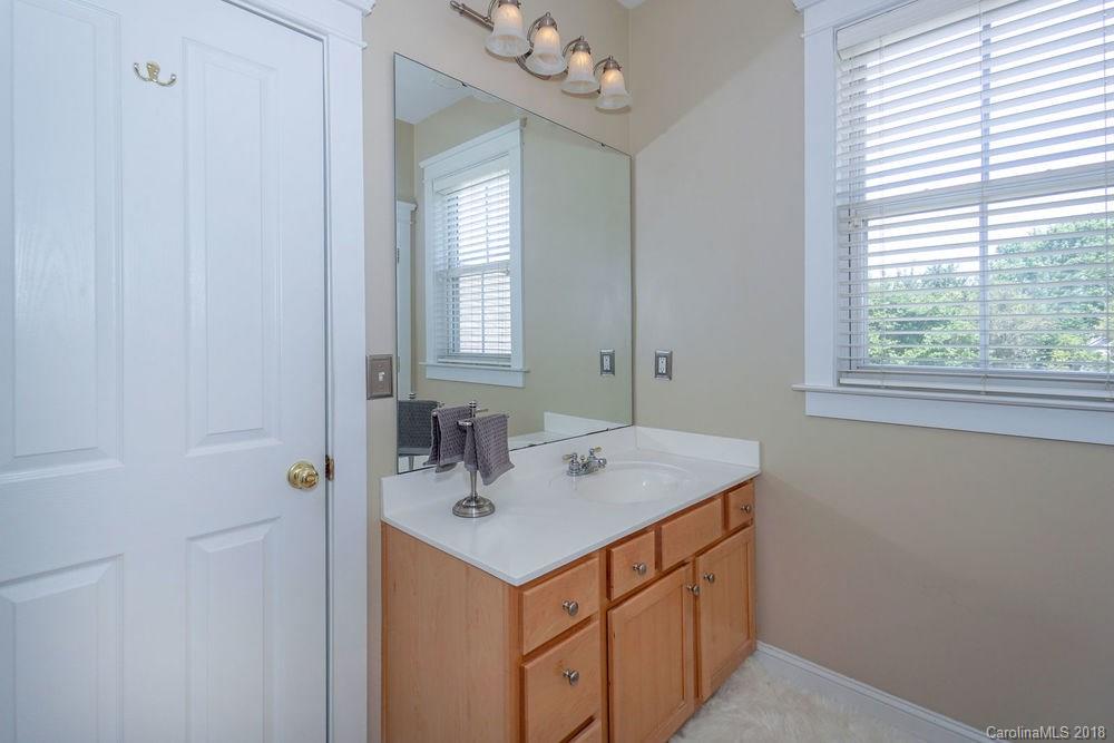 8117 Strandhill Road Huntersville, NC 28078 - Photo 19 of 36 a bathroom with a sink vanity and a mirror