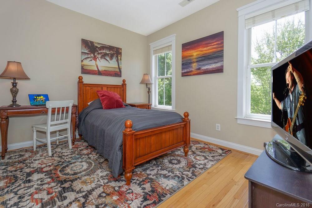 8117 Strandhill Road Huntersville, NC 28078 - Photo 20 of 36 a bedroom with a bed window and a flat screen television