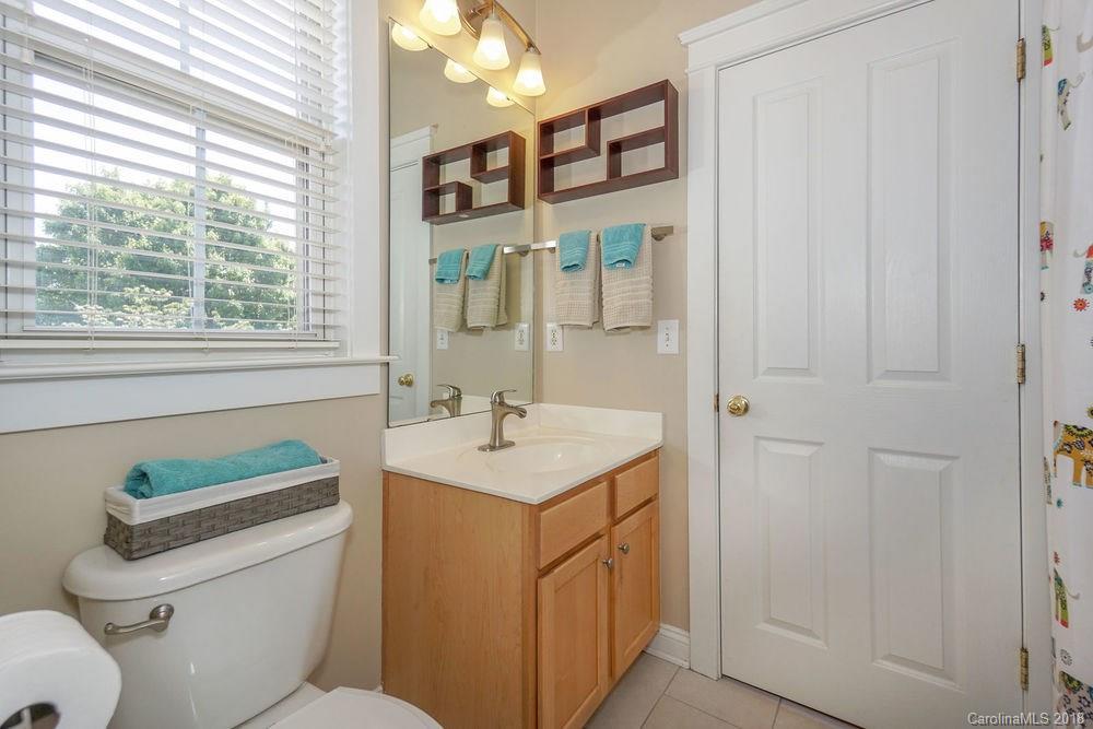8117 Strandhill Road Huntersville, NC 28078 - Photo 22 of 36 a bathroom with a sink a toilet and a mirror