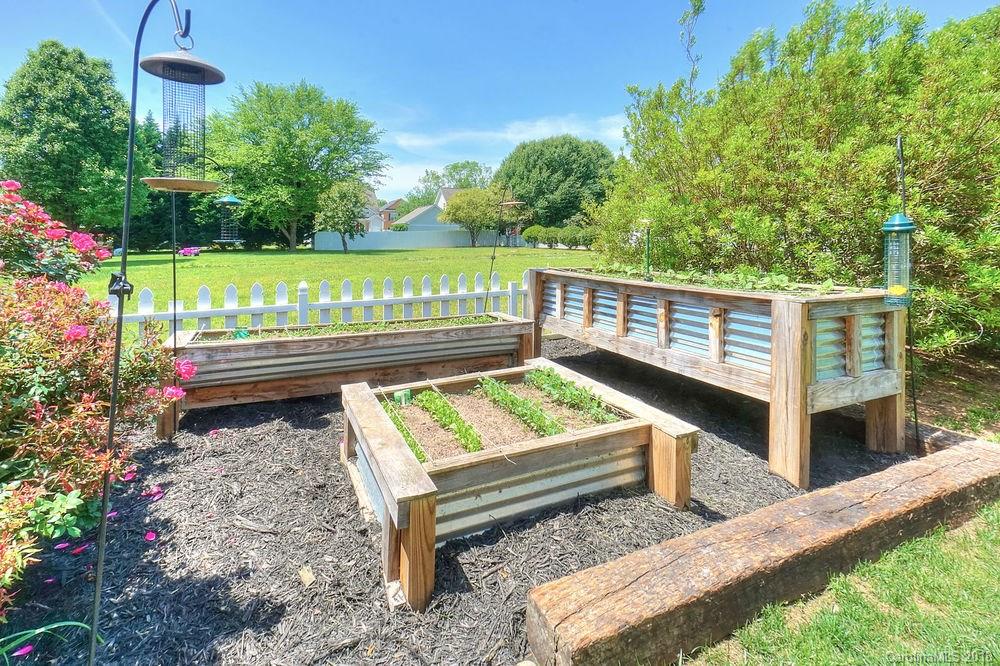 8117 Strandhill Road Huntersville, NC 28078 - Photo 25 of 36 a view of a bench in the garden