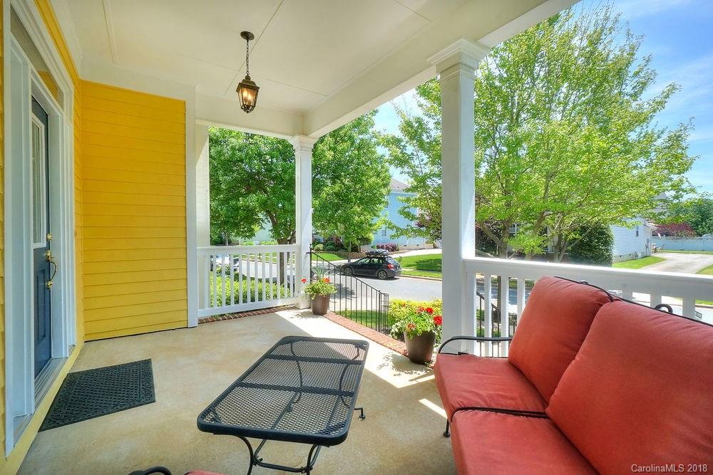 8117 Strandhill Road Huntersville, NC 28078 - Photo 6 of 36 a balcony with furniture and a garden