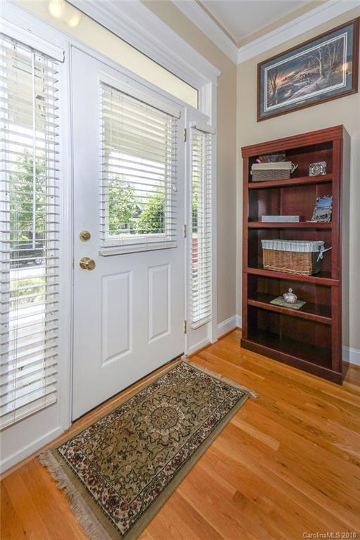 8117 Strandhill Road Huntersville, NC 28078 - Photo 8 of 36 a view of an empty room with a window and wooden floor