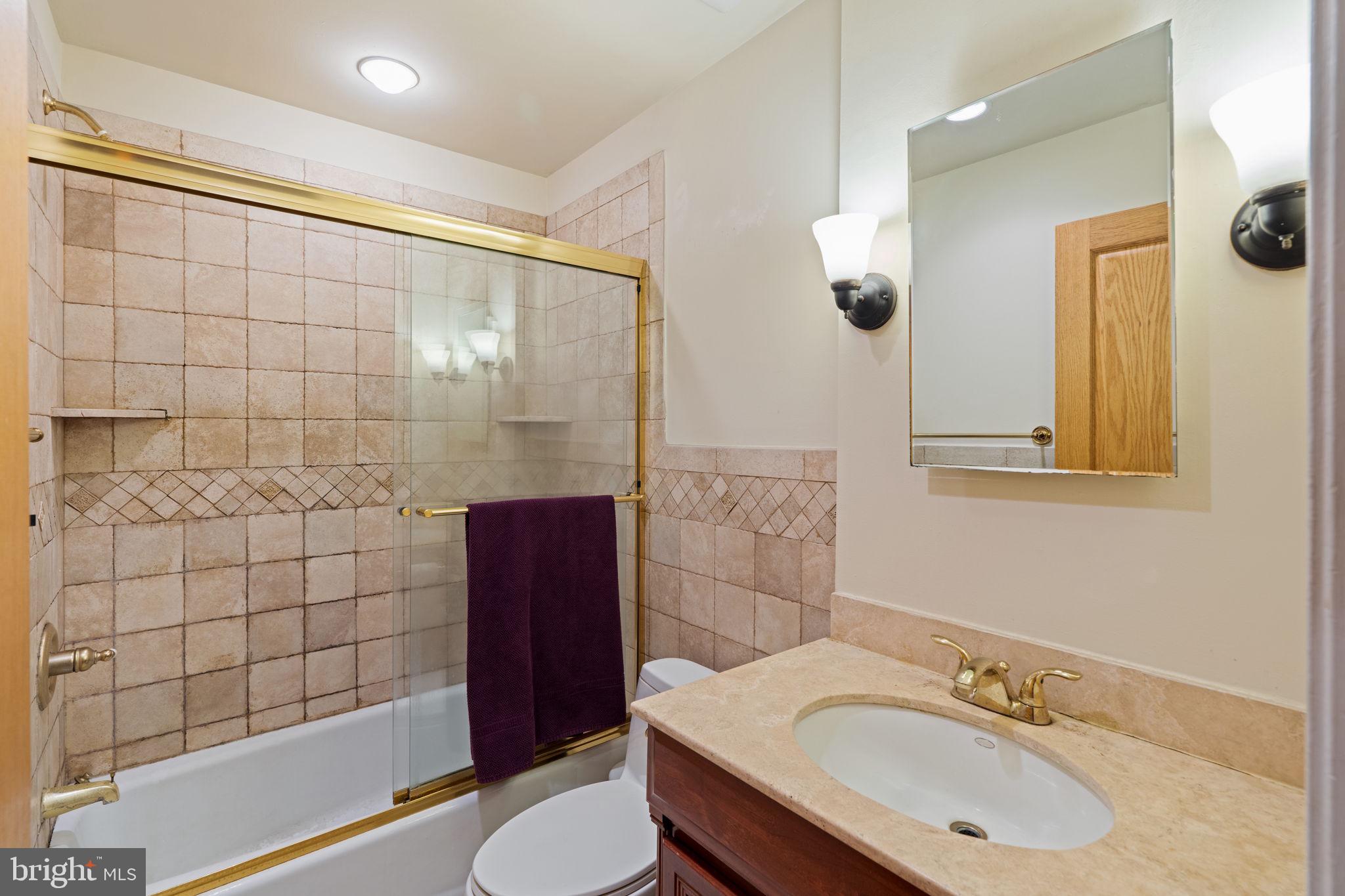 929 Clinton Street, Unit 1F Philadelphia, PA 19107 - Photo 24 of 41 a bathroom with a sink a toilet and shower