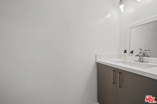 a bathroom with a sink and vanity