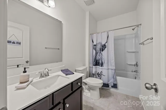 a bathroom with a sink toilet tub and shower