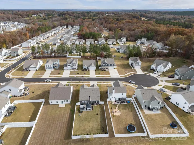 an aerial view of a house with lake view
