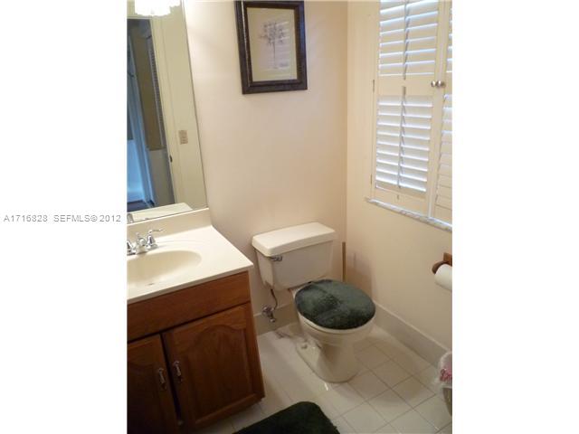 4070 Tree Top Road Cooper City, FL 33026 - Photo 6 of 12 a bathroom with a sink and a toilet