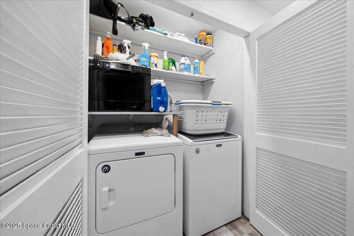 1405 Fiddler Avenue Merritt Island, FL 32952 - Photo 14 of 43 a utility room with dryer and washer