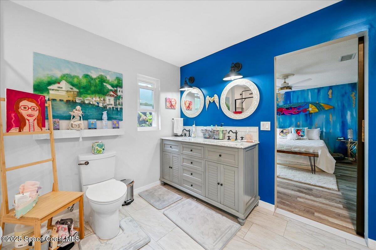 1405 Fiddler Avenue Merritt Island, FL 32952 - Photo 16 of 43 a living room with furniture a clock and a large window