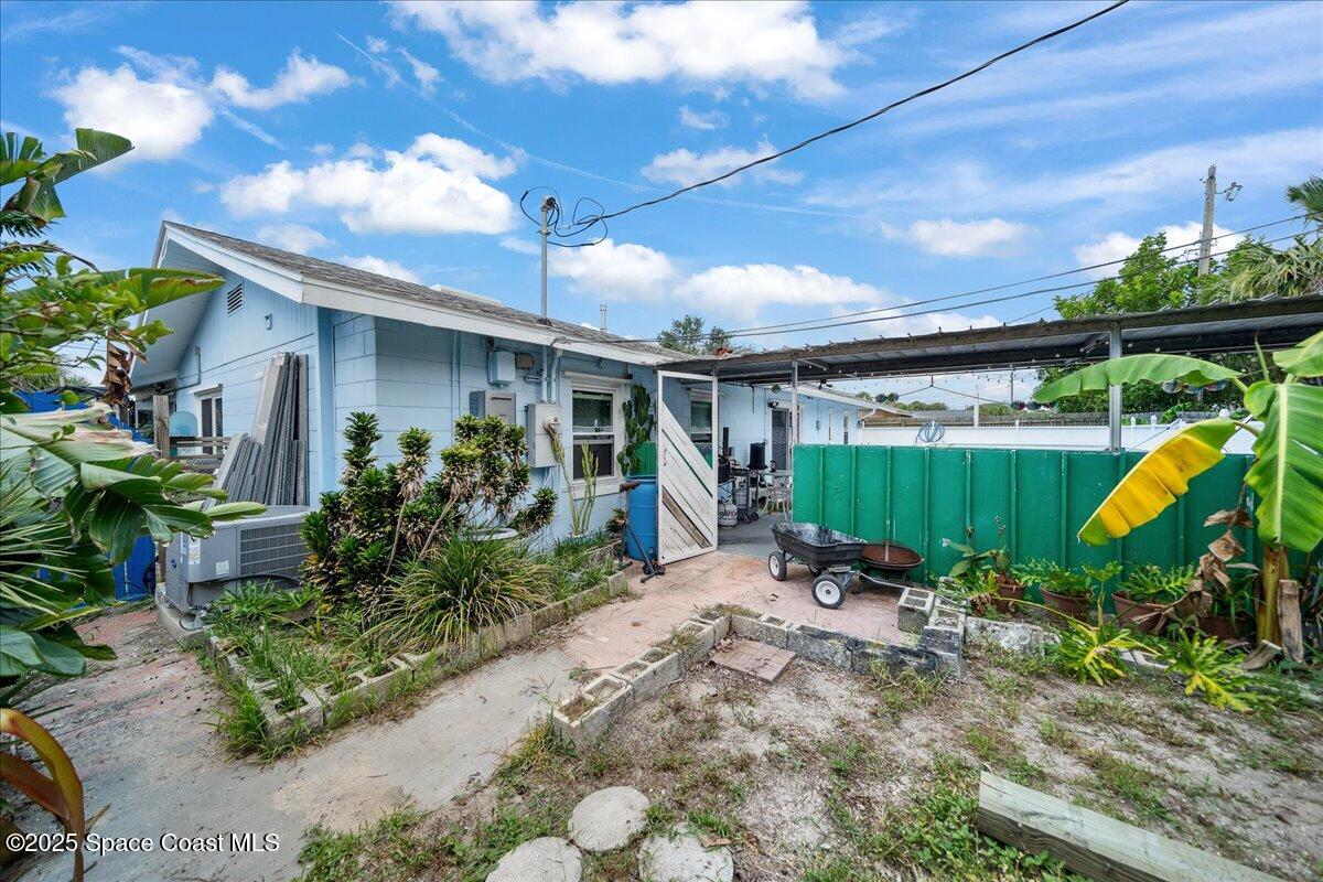 1405 Fiddler Avenue Merritt Island, FL 32952 - Photo 26 of 43 a view of a house with backyard and a patio