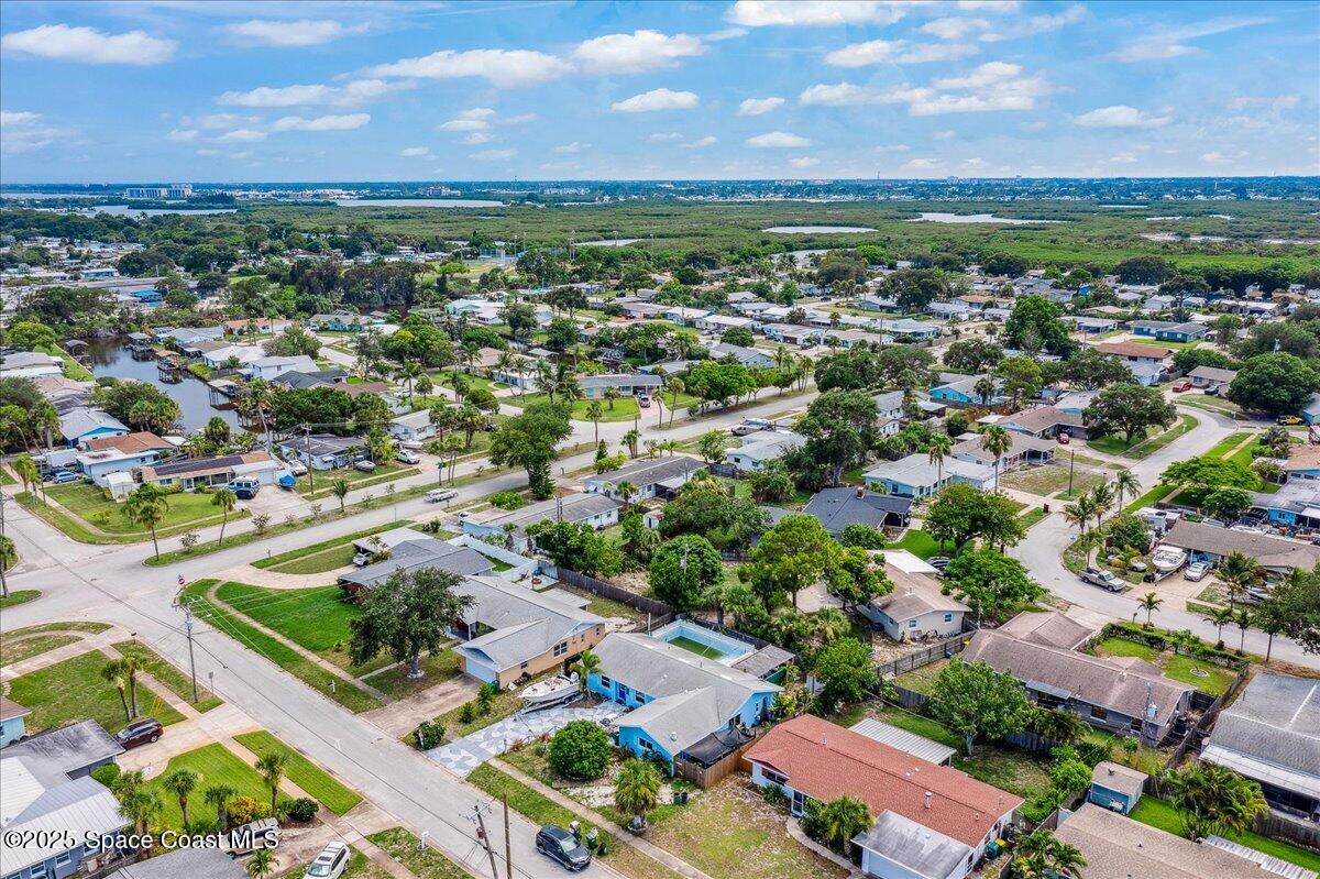 1405 Fiddler Avenue Merritt Island, FL 32952 - Photo 36 of 43 an aerial view of residential houses with outdoor space and ocean view