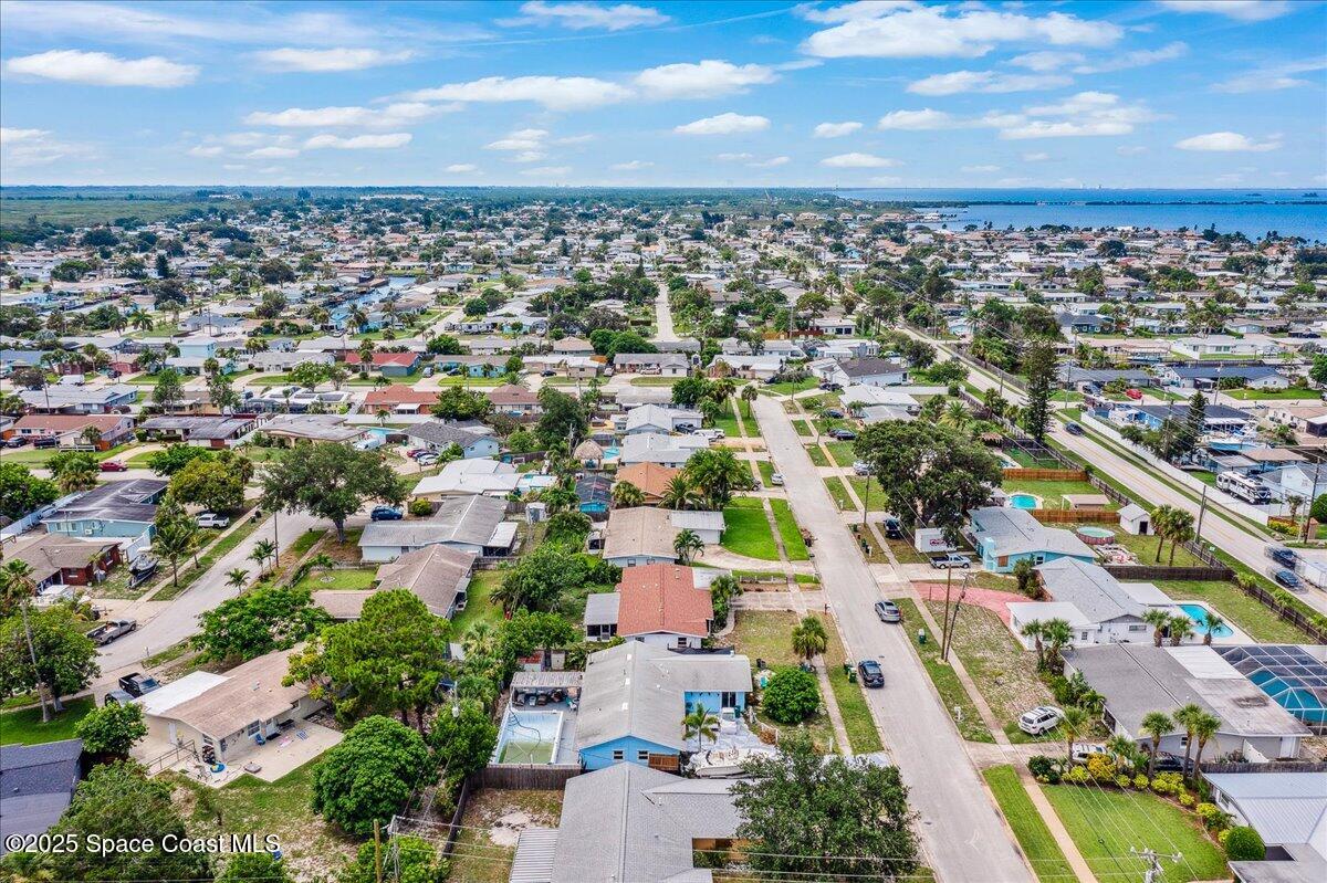 1405 Fiddler Avenue Merritt Island, FL 32952 - Photo 41 of 43 an aerial view of residential houses with outdoor space