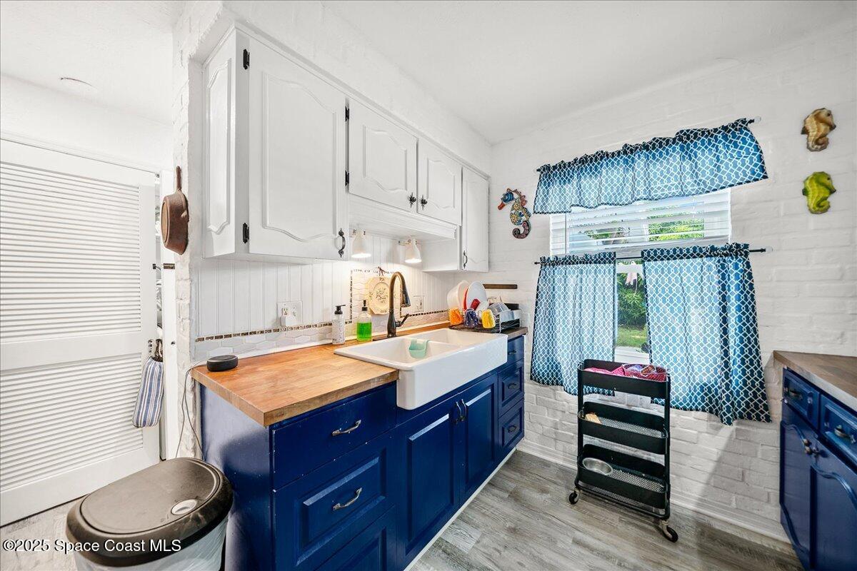 1405 Fiddler Avenue Merritt Island, FL 32952 - Photo 10 of 43 a bed room with a bed and a chair