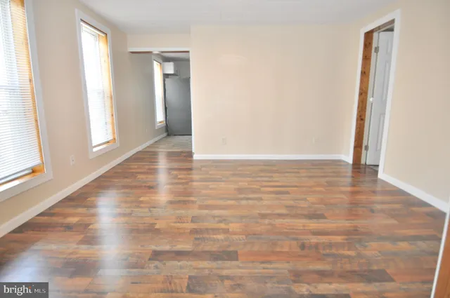 a view of an empty room and window