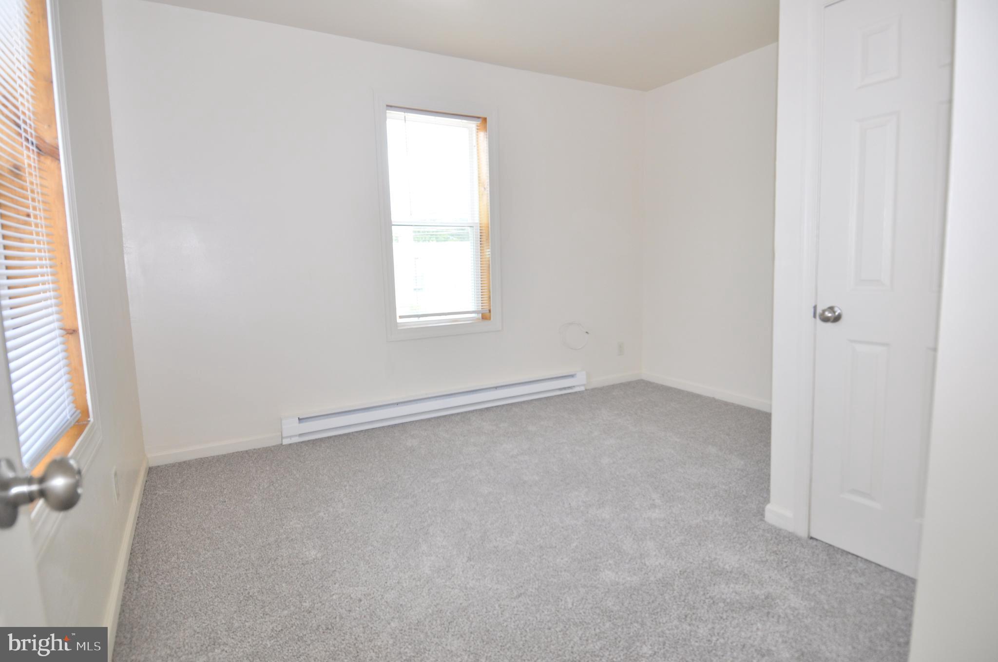 601 4th Street Pocomoke City, MD 21851 - Photo 21 of 35 an empty room with a window