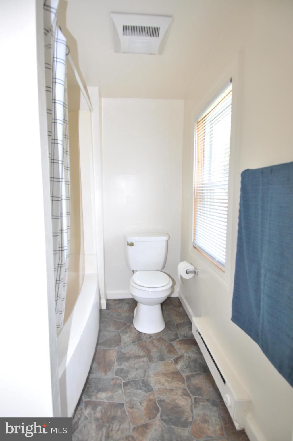 601 4th Street Pocomoke City, MD 21851 - Photo 23 of 35 a bathroom with a toilet sink and a bathtub