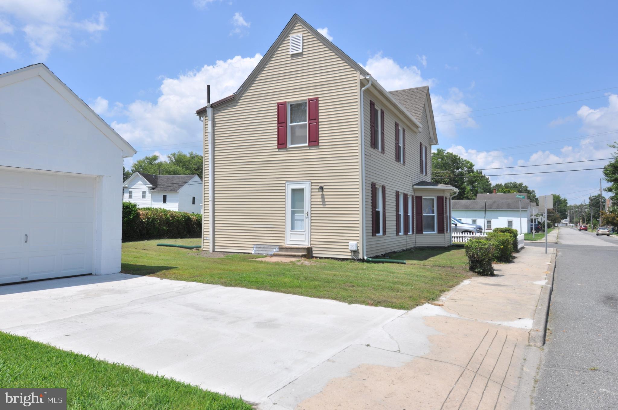 601 4th Street Pocomoke City, MD 21851 - Photo 4 of 35 a view of a house with a yard and pathway