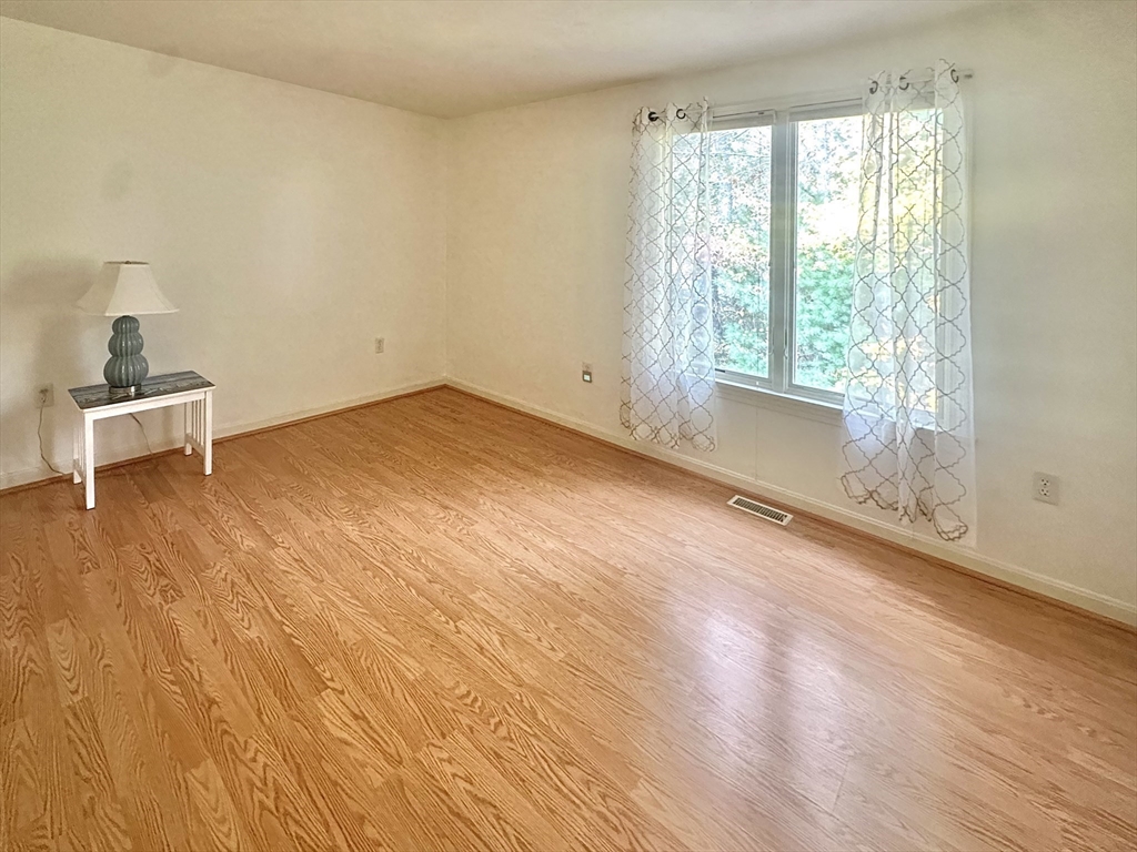 4 North Ridge Road, Unit 431 Mashpee, MA 02649 - Photo 14 of 25 a big room with wooden floor and windows