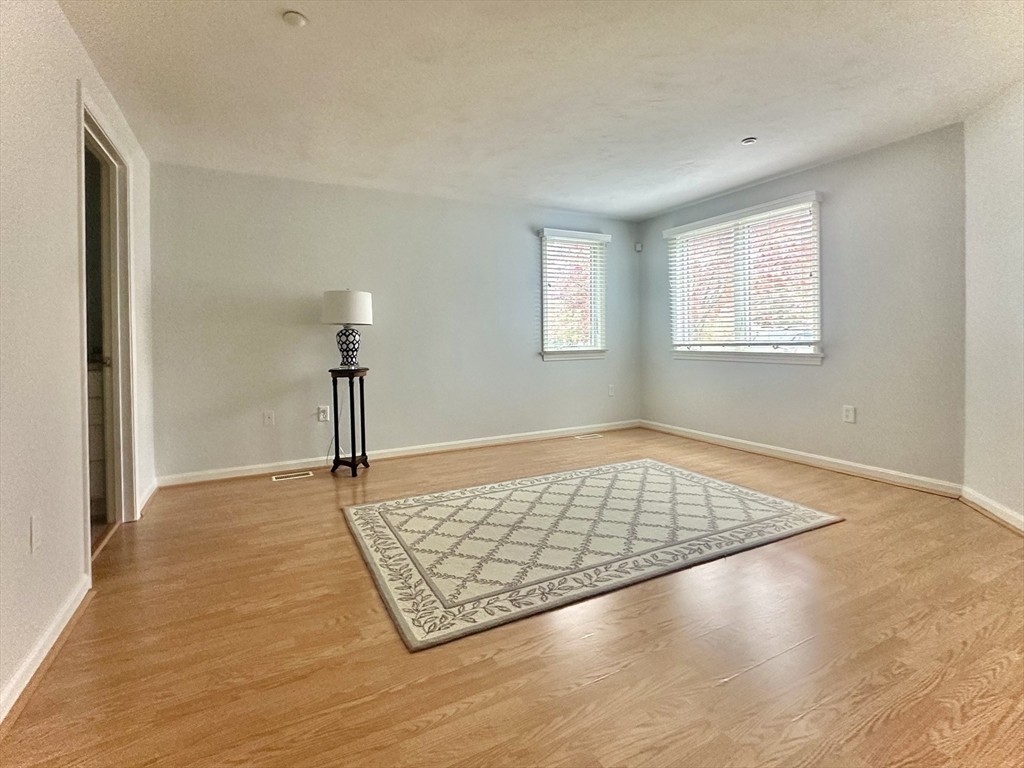 4 North Ridge Road, Unit 431 Mashpee, MA 02649 - Photo 18 of 25 a view of empty room with window and wooden floor