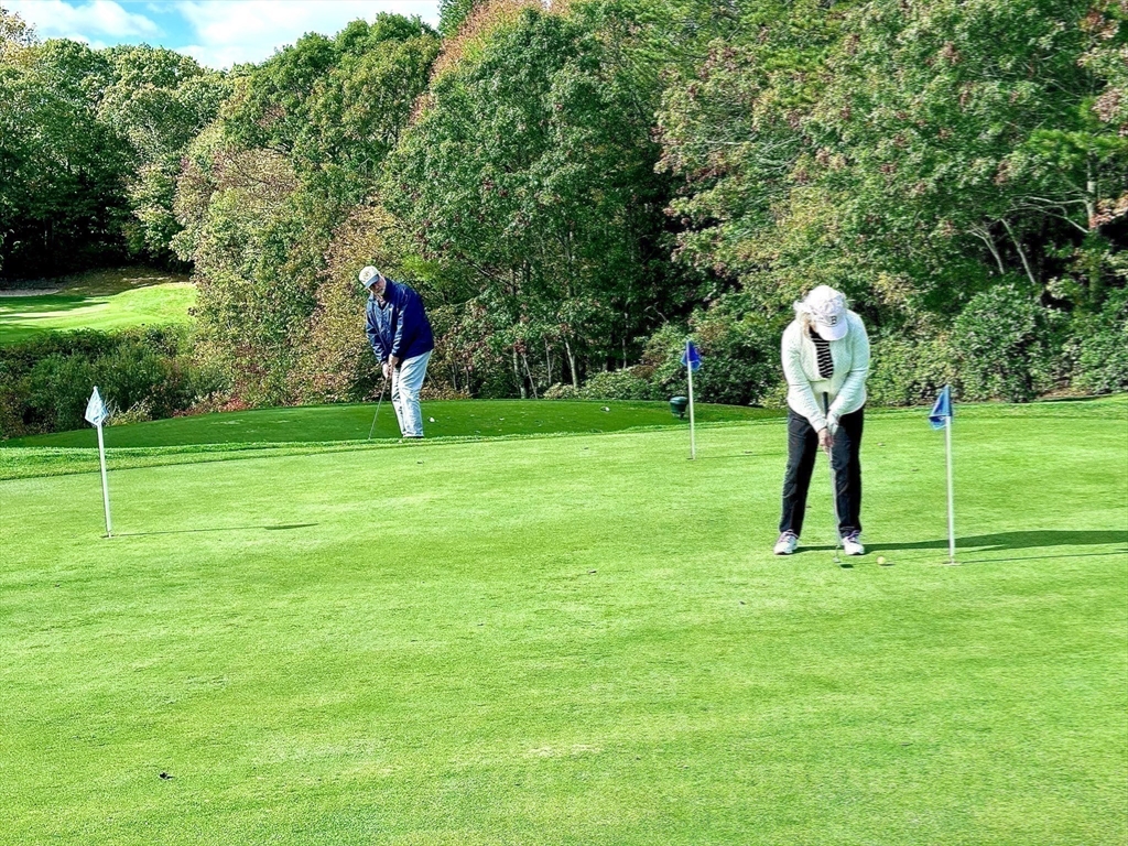 4 North Ridge Road, Unit 431 Mashpee, MA 02649 - Photo 25 of 25 a front view of a house with a yard and trees