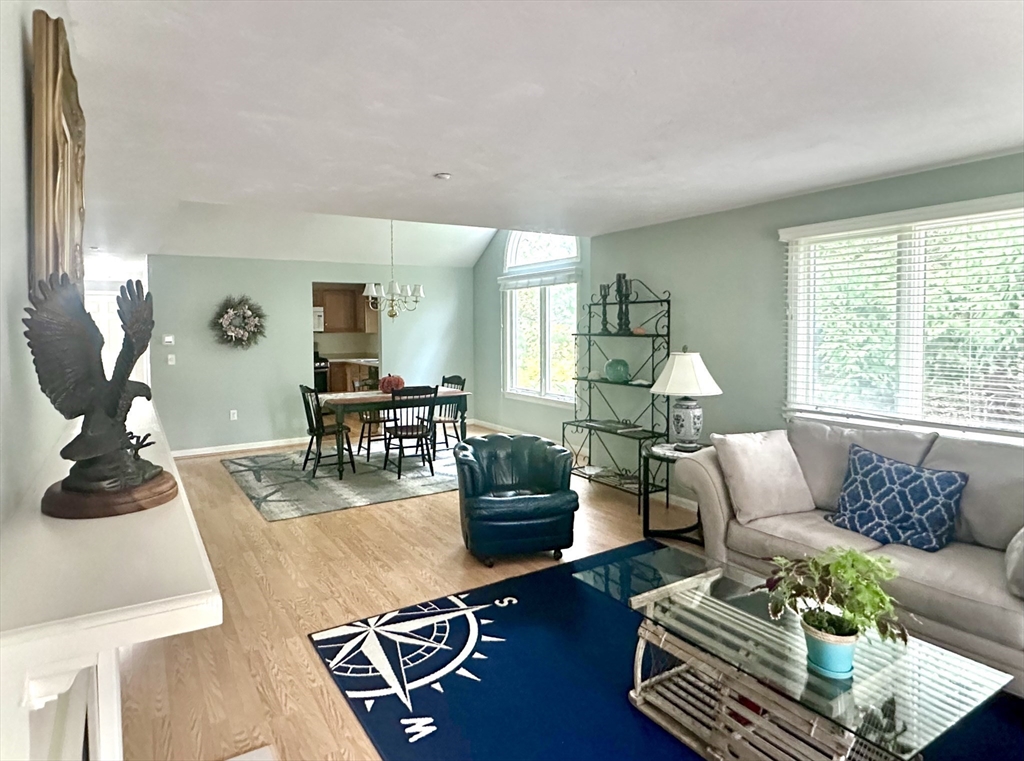 4 North Ridge Road, Unit 431 Mashpee, MA 02649 - Photo 9 of 25 a living room with furniture and wooden floor