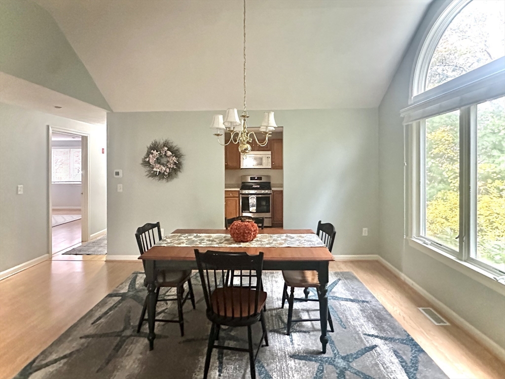 4 North Ridge Road, Unit 431 Mashpee, MA 02649 - Photo 10 of 25 a view of a dining room with furniture window and outside view