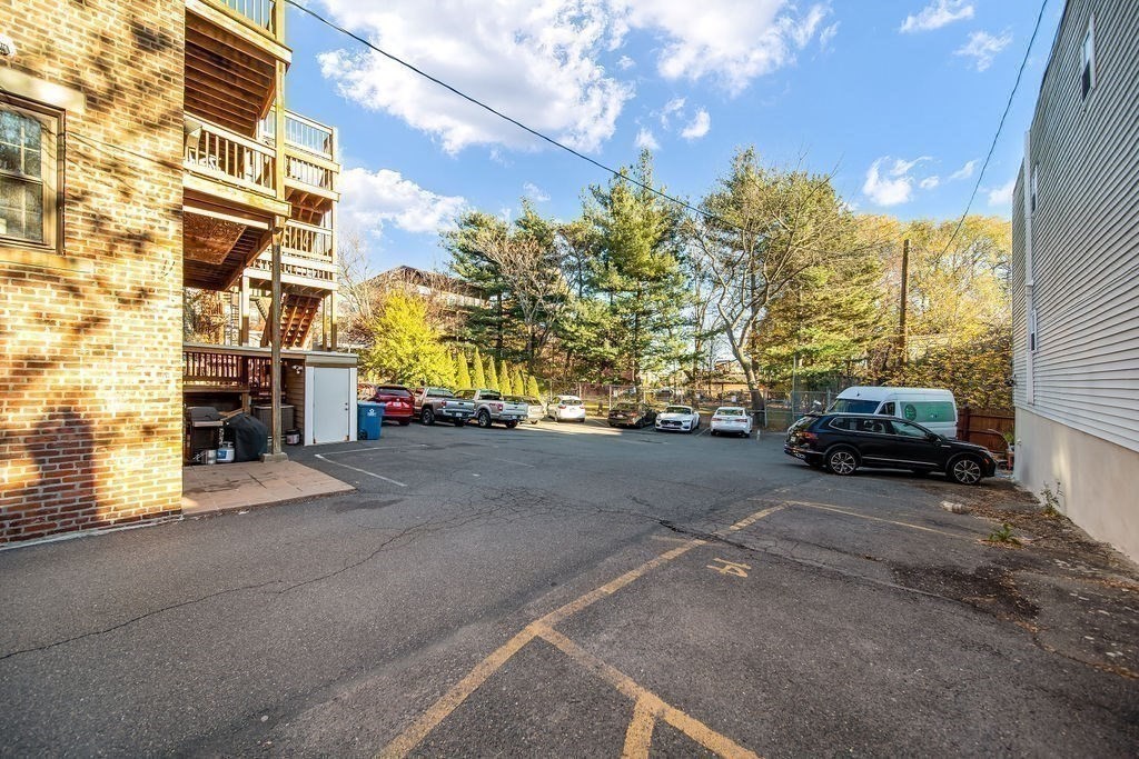 81 Broadway, Unit 1 Chelsea, MA 02150 - Photo 24 of 29 a view of street with parked cars