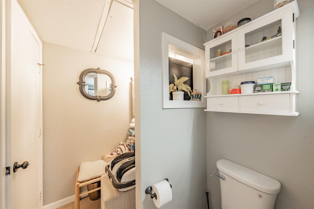 623 Ridgeline Drive Hurst, TX 76053 - Photo 23 of 29 a bathroom with a sink and a toilet