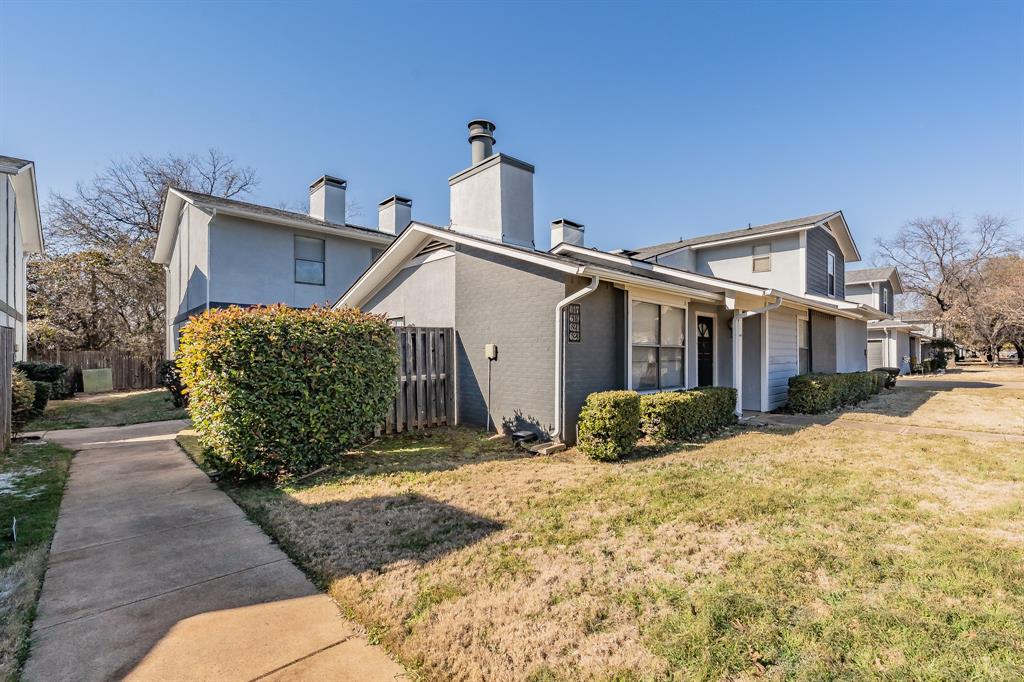 623 Ridgeline Drive Hurst, TX 76053 - Photo 27 of 29 a front view of a house with a yard covered in snow