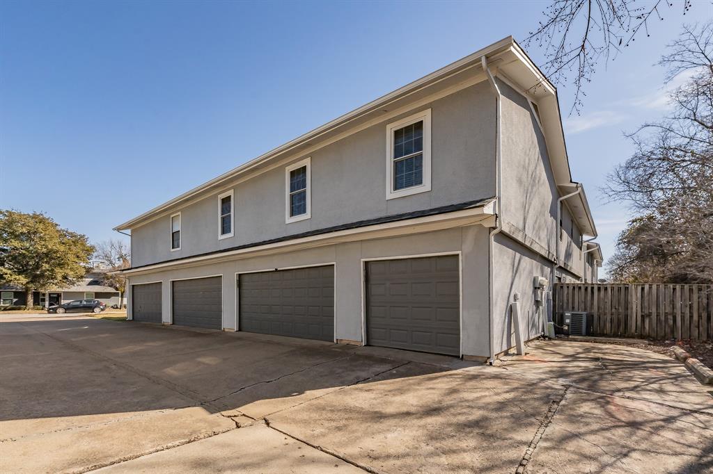 623 Ridgeline Drive Hurst, TX 76053 - Photo 28 of 29 a front view of a house with a yard and garage