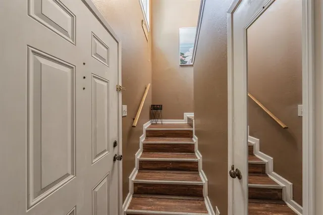 a view of staircase with wooden floor and stairs