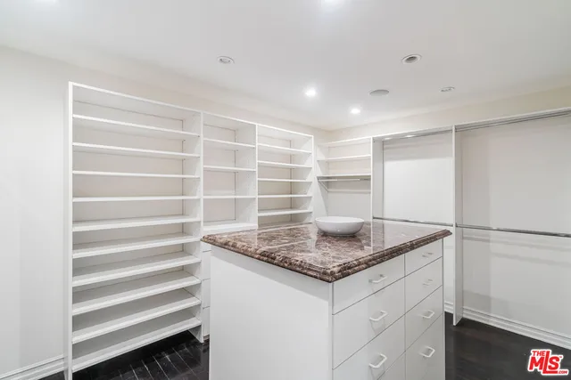 a view of kitchen cabinets and microwave