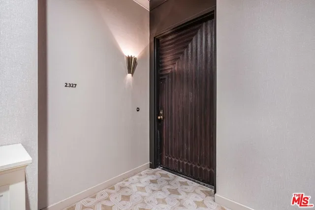 a view of a backyard with table and chairs and potted plants