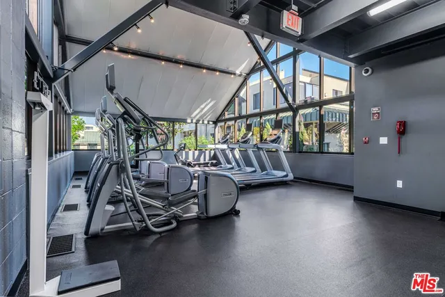 a green field with some trees in the background