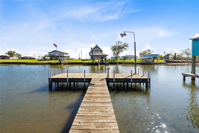 a view of a swimming pool with outdoor seating
